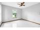 Spare bedroom with tile floors, neutral walls and ample natural light at 8466 Eldridge Rd, Spring Hill, FL 34608