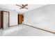 Spacious empty bedroom with tile floors, ceiling fan, and neutral walls at 8466 Eldridge Rd, Spring Hill, FL 34608
