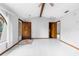 Bright living room with tile floors, a wooden front door, and ample natural light at 8466 Eldridge Rd, Spring Hill, FL 34608