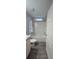 Bathroom featuring shower/tub combo and a white sink/cabinet combination at 9625 Pat St, Hudson, FL 34669