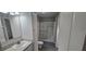 Bright bathroom with a functional shower area, modern sink, and ample storage space at 9625 Pat St, Hudson, FL 34669