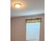 Bright bedroom features a window with blinds for natural light and privacy at 9625 Pat St, Hudson, FL 34669