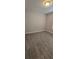 Bedroom featuring wood-look floors and neutral color scheme at 9625 Pat St, Hudson, FL 34669