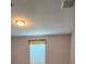 Bright bedroom features a window with blinds for natural light and privacy at 9625 Pat St, Hudson, FL 34669