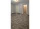 Bedroom featuring wood-look floors, leading to a closet and bright white trim at 9625 Pat St, Hudson, FL 34669