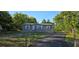Charming single-story home features a well-maintained yard, driveway, and appealing exterior paint at 9625 Pat St, Hudson, FL 34669