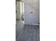 Functional laundry room area with modern flooring and essential hookups at 9625 Pat St, Hudson, FL 34669