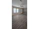 Inviting living room with modern flooring and ample natural light, showcasing an open and airy space at 9625 Pat St, Hudson, FL 34669