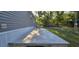 A concrete patio, accented by brick edging, extends from the side of the residence, offering an outdoor retreat at 9625 Pat St, Hudson, FL 34669