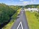 Aerial perspective of the runway highlighting its well-maintained condition and surrounding landscape at 10318 Piper Dr, New Port Richey, FL 34654