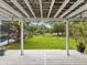 A view from the back porch to the backyard which includes a fire pit at 10318 Piper Dr, New Port Richey, FL 34654