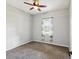 A calm bedroom with a window overlooking the neighborhood at 10318 Piper Dr, New Port Richey, FL 34654