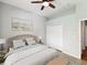 Inviting bedroom with a queen bed, closet, and soft lighting, offering a comfortable and restful atmosphere at 10318 Piper Dr, New Port Richey, FL 34654