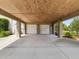 Spacious two-car carport provides sheltered parking with concrete floor and convenient access to the home at 10318 Piper Dr, New Port Richey, FL 34654