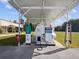 A well-maintained aircraft fuel station near a landing strip and hangers at 10318 Piper Dr, New Port Richey, FL 34654