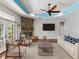 Comfortable living room featuring a stone fireplace, modern furniture, and ample natural light at 10318 Piper Dr, New Port Richey, FL 34654