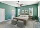 Cozy bedroom featuring a wooden bed frame, decor, and a ceiling fan at 10318 Piper Dr, New Port Richey, FL 34654