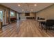 A large meeting room features neutral walls and flooring, recessed lighting, ceiling fans, and many chairs at 10318 Piper Dr, New Port Richey, FL 34654