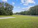 Scenic view of the Hidden Lake Airport runway surrounded by lush greenery at 10318 Piper Dr, New Port Richey, FL 34654
