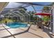 Inviting screened-in pool area with a dining table, ideal for outdoor enjoyment at 10372 Fairchild Rd, Spring Hill, FL 34608