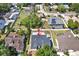 An aerial view of the property showcasing the roof, surrounding greenery, and the layout of the neighborhood at 10423 Ashley Oaks Dr, Riverview, FL 33578
