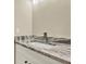 Bathroom features a granite countertop and stainless steel faucet at 10423 Ashley Oaks Dr, Riverview, FL 33578