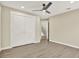 This bedroom has wood-look floors and a double closet at 10423 Ashley Oaks Dr, Riverview, FL 33578