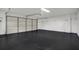 Spacious garage with freshly epoxied floor, offering ample storage and parking at 10423 Ashley Oaks Dr, Riverview, FL 33578
