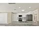Modern kitchen featuring white cabinetry, stainless steel appliances, and a large island with a sink at 10423 Ashley Oaks Dr, Riverview, FL 33578