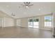 Spacious living room with a sliding glass door to the backyard, offering seamless indoor-outdoor living at 10423 Ashley Oaks Dr, Riverview, FL 33578