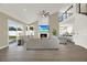 Bright living room with vaulted ceilings, fireplace, and large windows offering plenty of natural light at 10423 Ashley Oaks Dr, Riverview, FL 33578