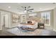 Spacious main bedroom with modern décor, ceiling fan, and bright windows at 10423 Ashley Oaks Dr, Riverview, FL 33578
