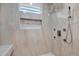 Modern shower features decorative inset and multiple shower heads at 10423 Ashley Oaks Dr, Riverview, FL 33578