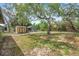 Generous backyard space includes a storage shed, perfect for outdoor equipment, and room for gardening or recreational activities at 10531 Lakeview Dr, New Port Richey, FL 34654