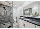 Bathroom with granite countertop vanity, neutral color palette, and glass shower stall at 10531 Lakeview Dr, New Port Richey, FL 34654