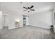 Spacious bedroom featuring modern ceiling fan, sliding closet door, and stylish tile flooring at 10531 Lakeview Dr, New Port Richey, FL 34654