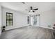 Bright bedroom with large windows and stylish tile flooring at 10531 Lakeview Dr, New Port Richey, FL 34654