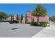 Exterior view of a unique pink building with palm trees and parking area at 10531 Lakeview Dr, New Port Richey, FL 34654