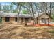 Charming single-story home with a three-car garage, set amongst mature trees and ample yard space at 10531 Lakeview Dr, New Port Richey, FL 34654