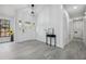 Bright foyer with decor, tiled floor, and a beautiful front door with decorative glass at 10531 Lakeview Dr, New Port Richey, FL 34654