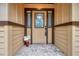 A lovely front door with glass inlays and stone pavers leading to the entrance at 10531 Lakeview Dr, New Port Richey, FL 34654