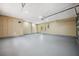 Spacious garage with ample lighting and neutral paint, providing a clean and functional space at 10531 Lakeview Dr, New Port Richey, FL 34654
