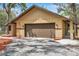 Close up of the home's facade highlighting the address and attached two car garage at 10531 Lakeview Dr, New Port Richey, FL 34654
