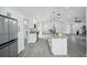 Open-concept kitchen with granite countertops, stainless steel appliances, and ample cabinet space at 10531 Lakeview Dr, New Port Richey, FL 34654