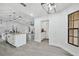 Open concept kitchen features island with breakfast bar, and a view to the living room beyond at 10531 Lakeview Dr, New Port Richey, FL 34654