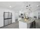 Bright kitchen featuring a spacious granite island with seating and stainless steel appliances at 10531 Lakeview Dr, New Port Richey, FL 34654