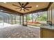 Comfortable screened-in patio with brick pavers and a sink, offering a peaceful outdoor living space at 10531 Lakeview Dr, New Port Richey, FL 34654