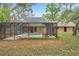 Backyard screened pool offers a private, outdoor retreat, perfect for relaxation and entertainment in a home setting at 10531 Lakeview Dr, New Port Richey, FL 34654