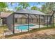 Enclosed pool area with clear blue water provides a private backyard oasis and includes ample deck space for lounging at 10531 Lakeview Dr, New Port Richey, FL 34654
