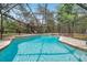 Sparkling in-ground pool with a screened enclosure offers the perfect spot for relaxation and recreation at 10531 Lakeview Dr, New Port Richey, FL 34654